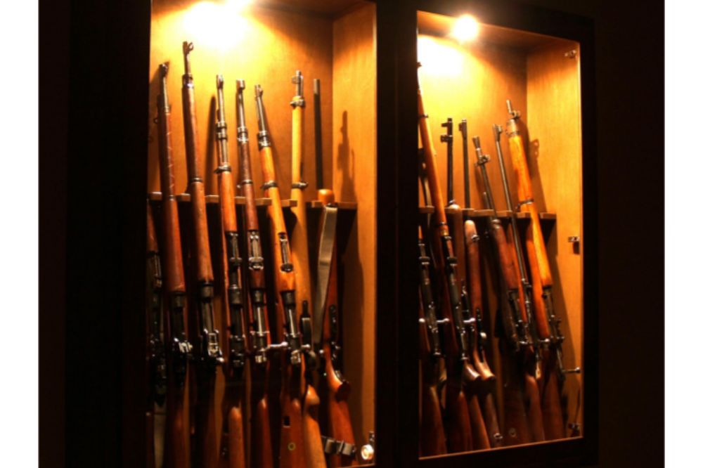 lots of rifle gun in cabinet